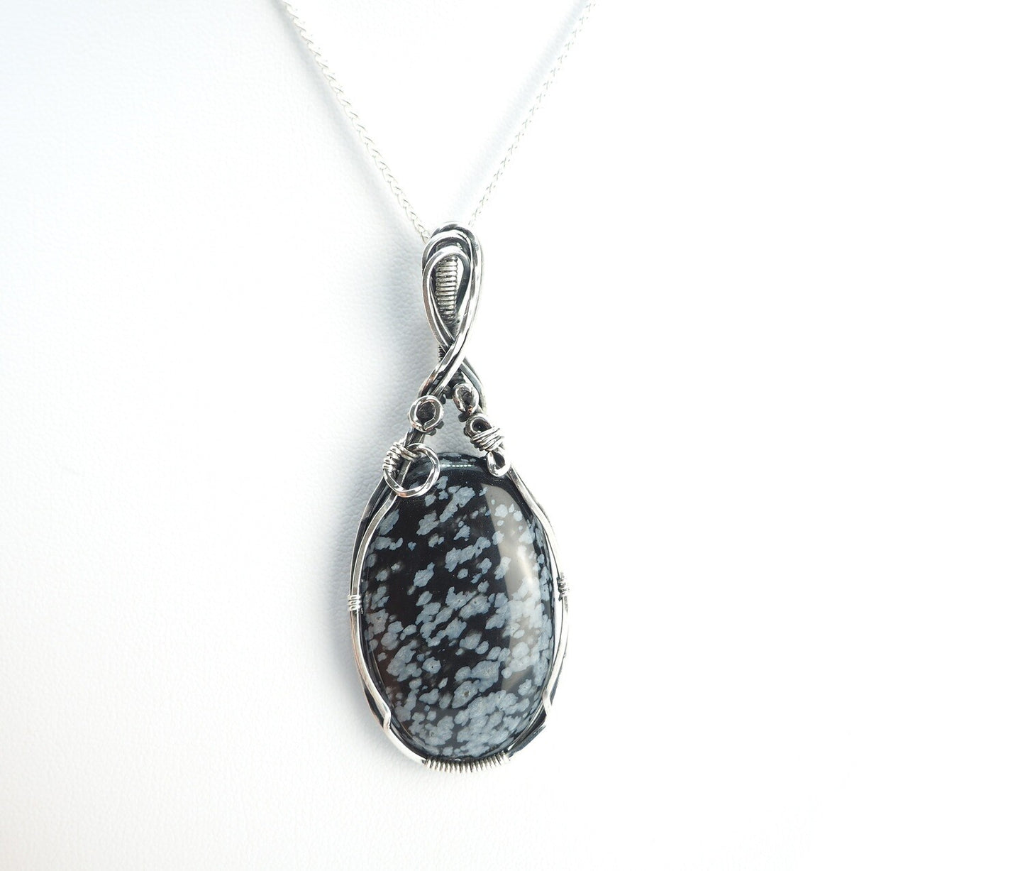 Snowflake Obsidian wrapped in Sterling Silver and Oxidised.