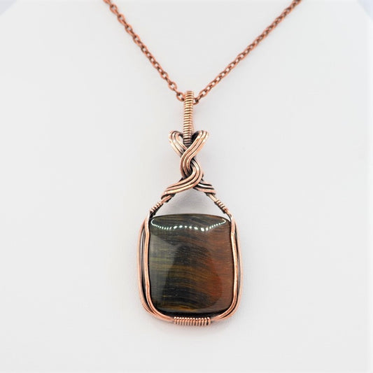 Blue Tigers Eye Cabochon wrapped in Copper and oxidised